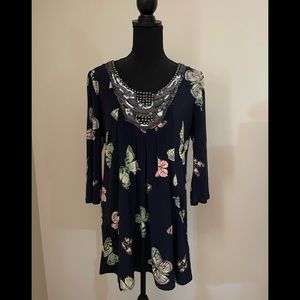 Navy blue tunic with butterflies.